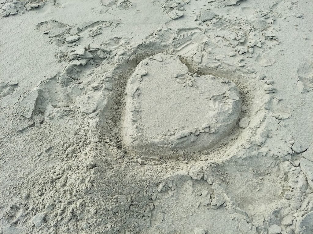 Heart shape drawn in the sand at Kiawah Island Beach, South Carolina.
